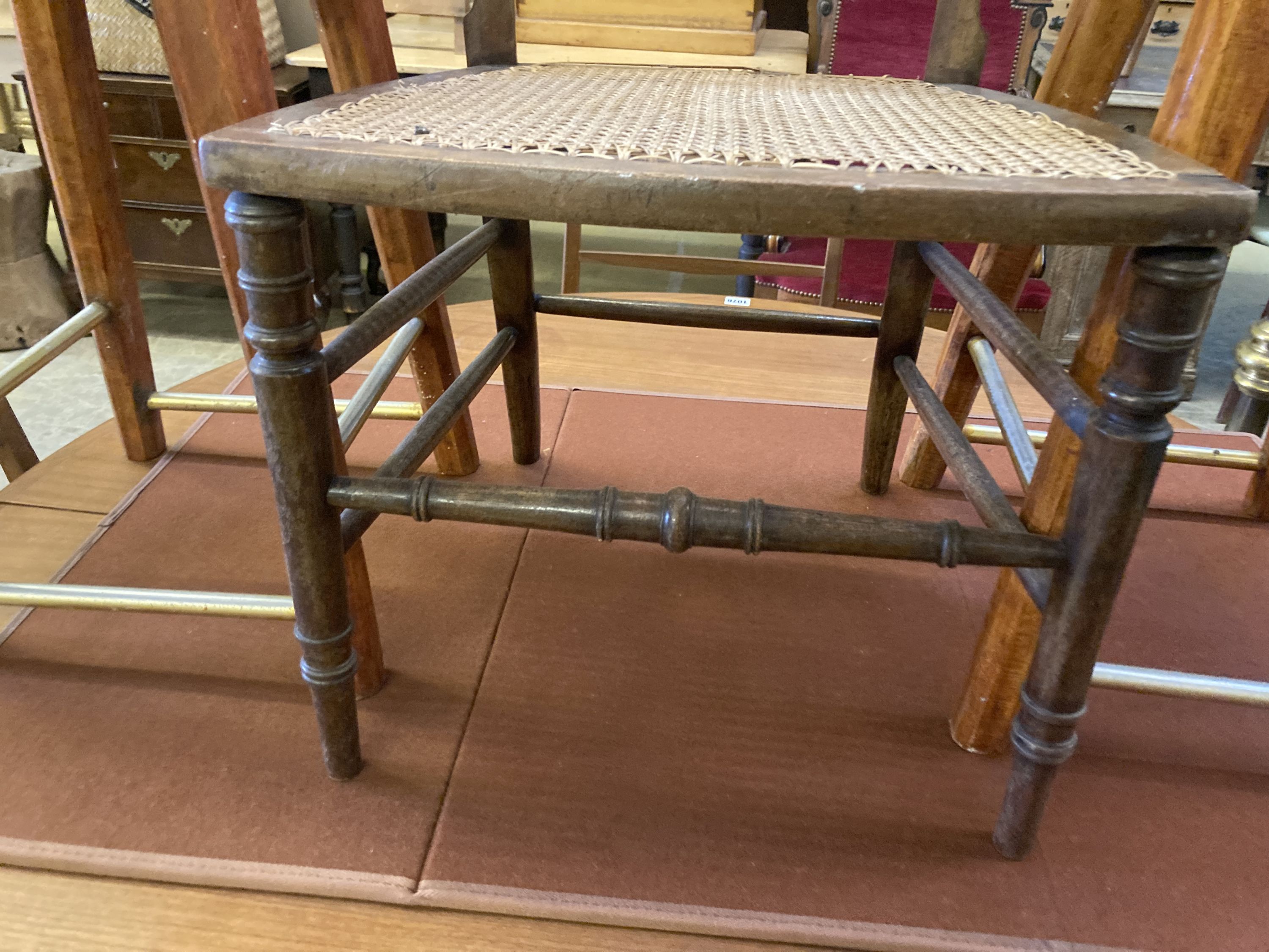 An Edwardian cane seat chair and a pair of beech stools